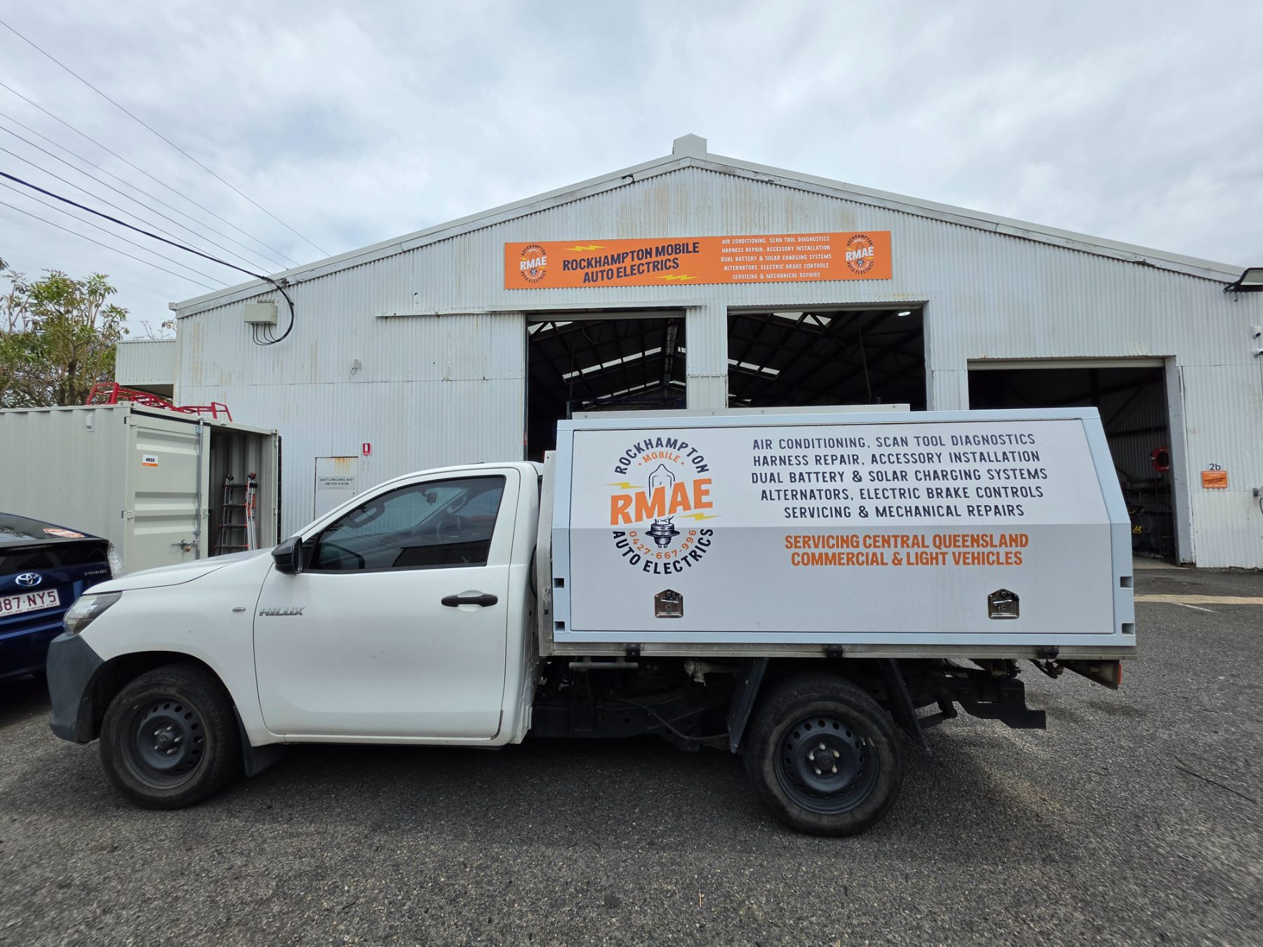 The RMAE Hilux service ute parked in front of the workshop